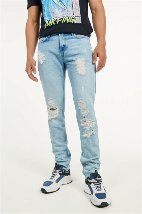 Jean Skinny Azul Claro Tiro Bajo Con Rotos Y 5 Bolsillos