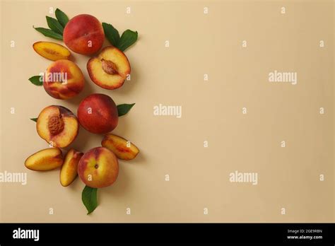 Ripe Peach Fruits With Leaves On Beige Background Stock Photo Alamy