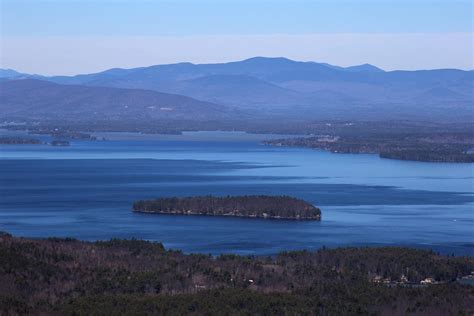 Brown Island at the Center of Blue Sea · Free Stock Photo