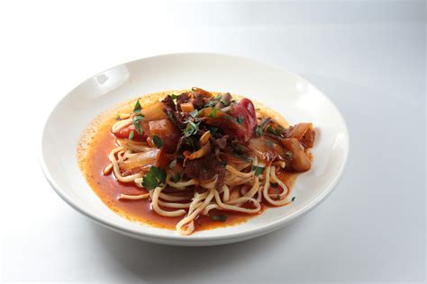 Cooked Pasta With Sliced tomatoes and Green Leafy · Free Stock Photo