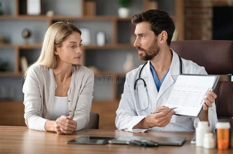 Therapist Talking With A Group At Therapy Session Stock Photo Image