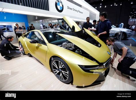 A BMW I8 Protonic Frozen Yellow Edition Is On Display During A Launch