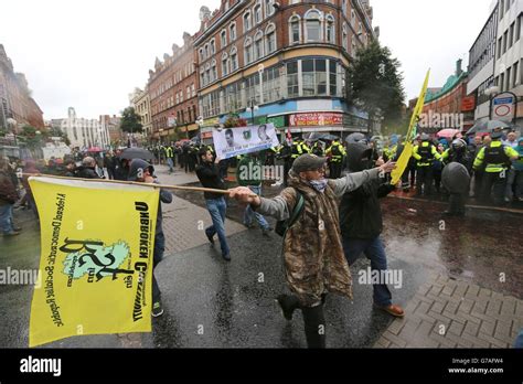 Police Separate Loyalist Flag Protesters From A Republican Parade In