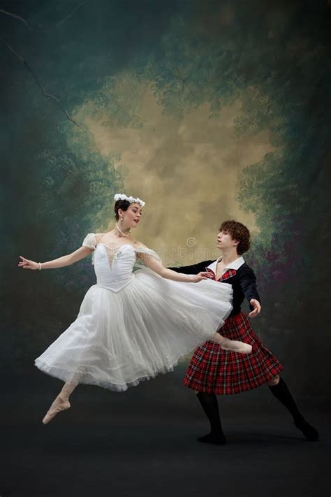 Ballerina Dressed In White Gown With Floral Headpieceleaping In