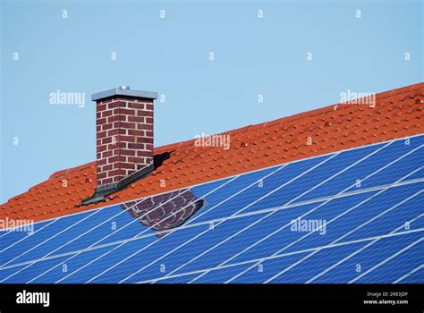 Tiled roof with photovoltaic cells Stock Photo - Alamy