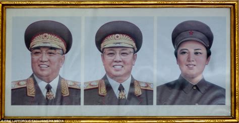 How North Koreans Place Portraits Of Kim Il Sung And Kim Jong Il In