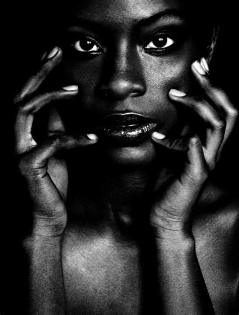 A Black And White Photo Of A Woman S Face With Her Hands On Her Face