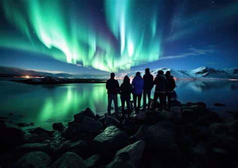 Premium AI Image | A tour group experiencing Aurora Borealis during a ...