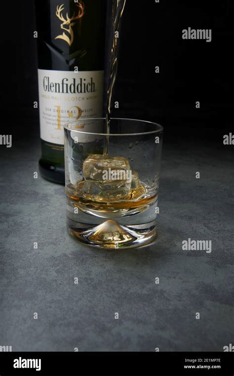 Close Up Of Whiskey Being Poured Into A Glass Hi Res Stock Photography