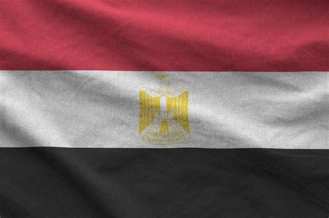 Egypt Flag Depicted On Folded Wavy Fabric Of Old Cloth Stock Photo