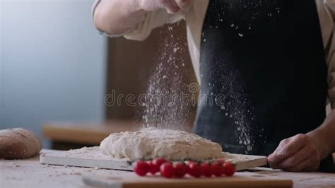 Close Up Of Bakery Chef Applying Flour On Dough Man Kneading Dough