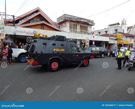 An Indonesian Police Are On Duties Beside The Police Car Editorial