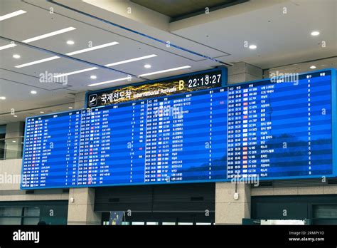 Flight arrival and departure sign board in Inchon airport, South Korea Stock Photo - Alamy