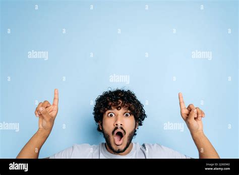 Shocked Surprised Indian Or Arabian Young Man In Basic T Shirt Amazed