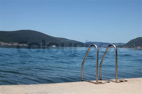 metal stigen på stranden i Tivat Stock foto Colourbox