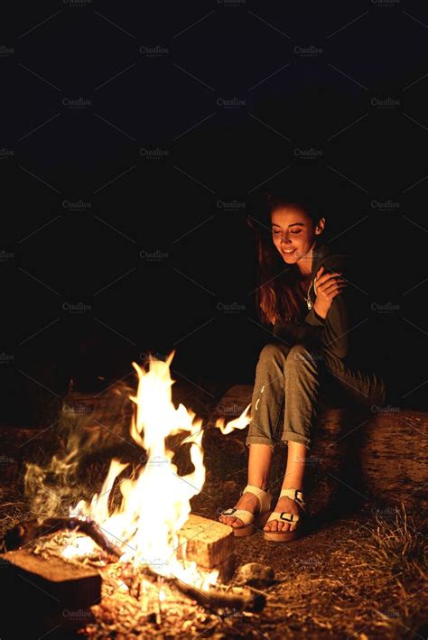 Girl at night near the campfire containing campfire, bonfire, and fire ...