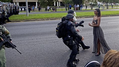 'Remarkable' photo of woman facing riot police that may define Black Lives Matter