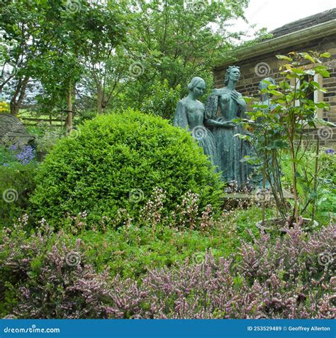 Bronte Sisters Statue And The Gardens Of The Bronte Museum In Haworth