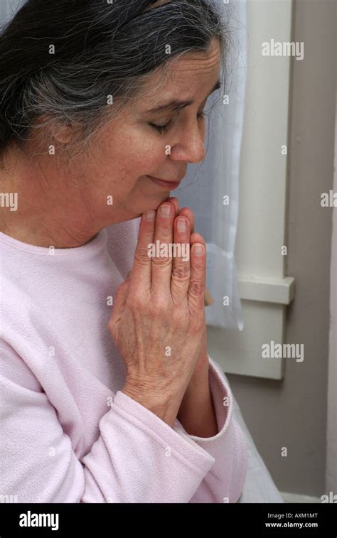 Caucasian Woman With Head Bowed And Praying Hi Res Stock Photography