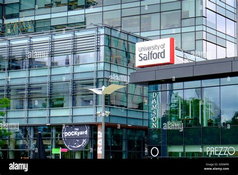 University Of Salford Sign At Mediacityuk Salford Quays Uk Stock