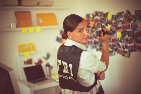 Fbi Woman Works On A Case Fbi Female Agent Using Camera Stock Photo