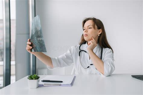 Young Caucasian Woman Doctor Wearing White Medical Coat And Stethoscope