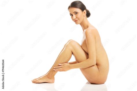 Side View Of Nude Woman Sitting Embracing Herself Stock Photo Adobe