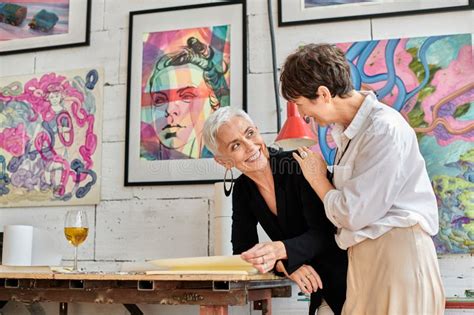 Fashionable And Happy Mature Lesbian Artists Stock Photo Image Of Paintings Contemporary