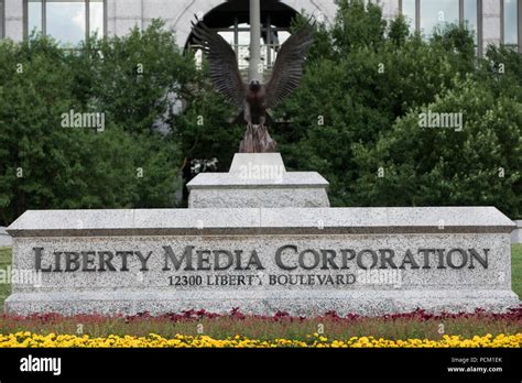 A Logo Sign Outside Of The Headquarters Of Liberty Media Corporation In