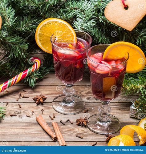 Two Glasses Of Hot Mulled Wine With Oranges Apples And Spices Stock