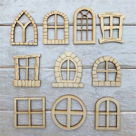 Wooden Cutouts Of Windows On A White Wood Background