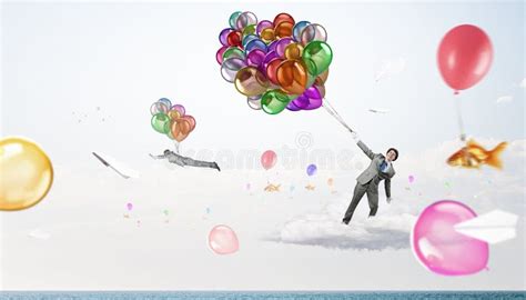 Humorous guy with balloons stock photo. Image of bunch - 67414526