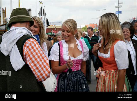 Girls In Traditional Bavarian Costumes At Oktoberfest In Munich Germany