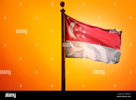 Singapore Flag, Flag waving with Sunrise Stock Photo - Alamy