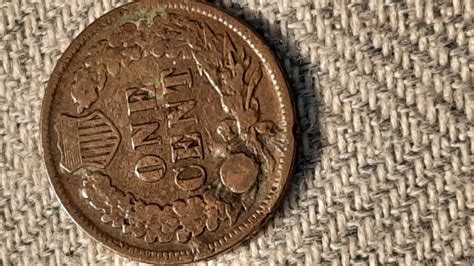 A few Indian Head Pennies, the 1909 has a indent that could possibly be ...