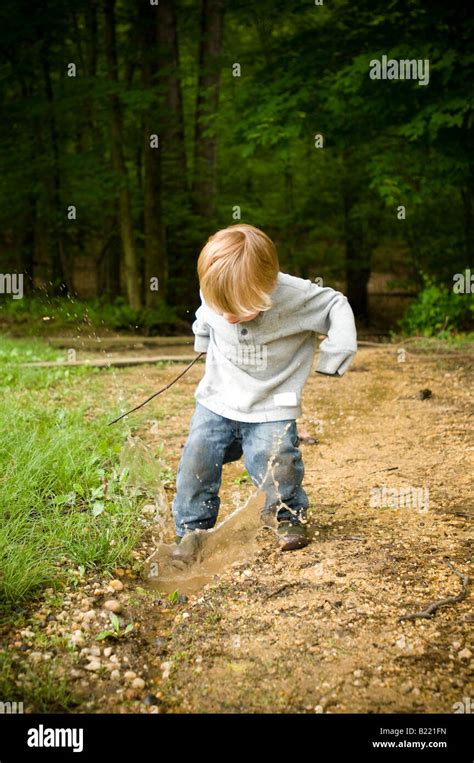 Kids Playing In Puddle Of Water Hi Res Stock Photography And Images Alamy