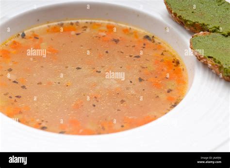 Classic Italian Minestrone Passato Soup With Pesto Crostini On Side