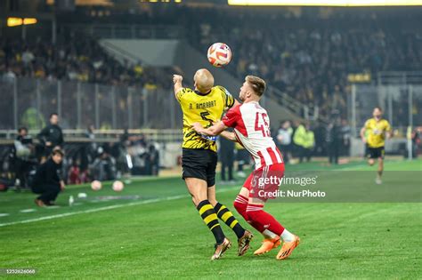 AMRABAT of AEK FC competing with 45 OLEG REABCIUK of Olympiacos FC ...