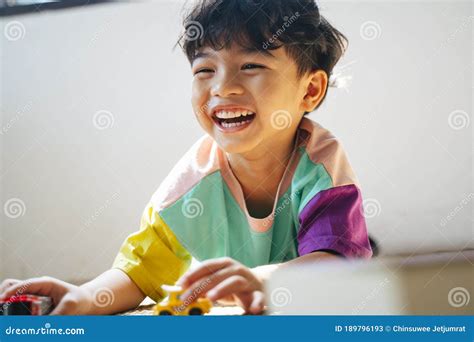 Little Boy Giggle While Playing Stock Image Image Of Festive Asian