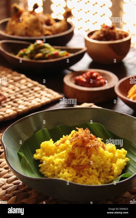 Nasi Kuning Traditional Indonesian Yellow Turmeric Rice Accompanied With Several Side Dishes