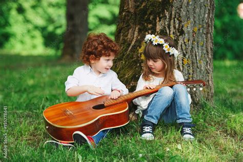 cute little children playing guitar Stock Photo | Adobe Stock