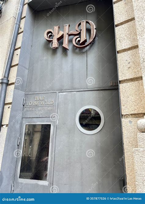 Bar To Be Wild Entrance with Metal Door and Circular Window Inviting