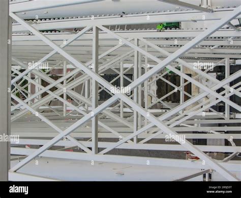 Abstract white structure. Stack of heavy metal reinforcement bars with ...