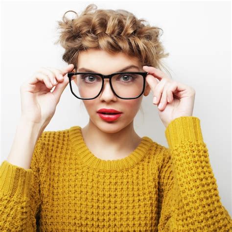 Premium Photo Portrait Of A Casual Woman In Glasses Looking At Camera Isolated On A White