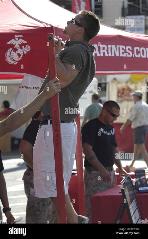 Visitors To A Us Marine Corps Recruiting Booth At A Street Fair