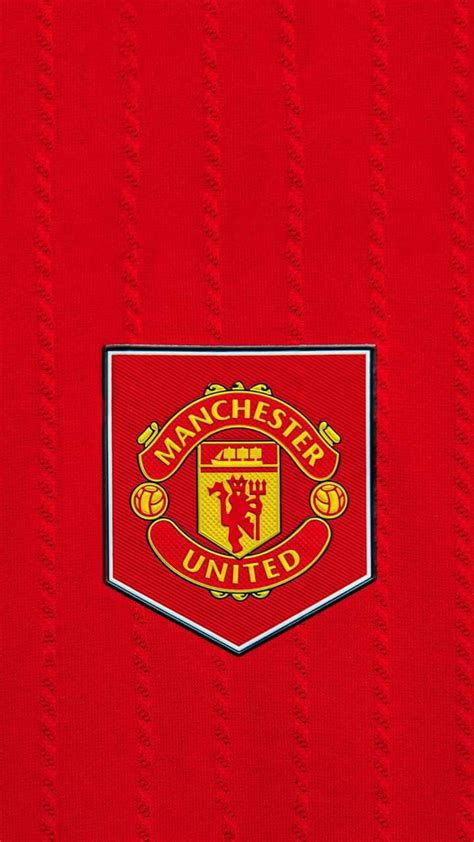 The Manchester United Crest On A Red Sweater