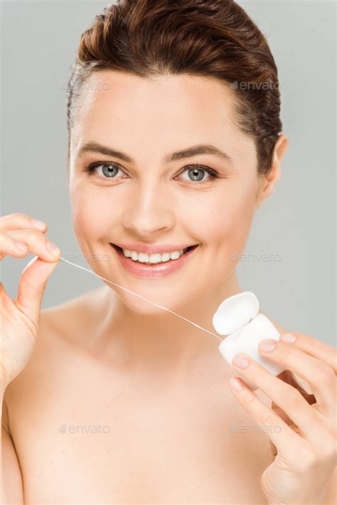 Happy Naked Woman Holding Dental Floss And Smiling Isolated On Grey