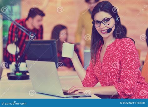 Portrait Of Happy Smiling Female Customer Support Phone Operator At