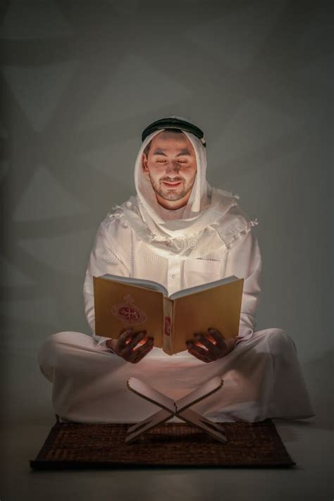 Muslim Prayer Sitting In Mosque And Read Holy Al Quran Book Stock Photo