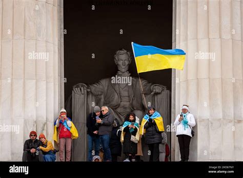 Protesters Stand With Ukrainian Flags In Front Of The Statue Of Lincoln